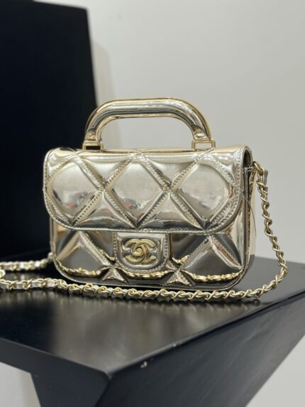 Chanel 25k gold patent leather handle flap bag